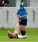 5 August 2013; Referee Sean Hurson attends to an injured Ruairi Cunningham, Westmeath, during the game. Electric Ireland GAA Football All-Ireland Minor Championship Quarter-Final, Mayo v Westmeath, O'Connor Park, Tullamore, Co. Offaly. Picture credit: David Maher / SPORTSFILE