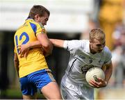 5 August 2013; Luke Flynn, Kildare, in action against Ultan Harney, Roscommon. Electric Ireland GAA Football All-Ireland Minor Championship Quarter-Final, Kildare v Roscommon, O'Connor Park, Tullamore, Co. Offaly. Picture credit: David Maher / SPORTSFILE