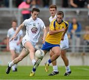 5 August 2013; Cein McMonagle, Kildare, in action against Ultan Harney, Roscommon. Electric Ireland GAA Football All-Ireland Minor Championship Quarter-Final, Kildare v Roscommon, O'Connor Park, Tullamore, Co. Offaly. Picture credit: David Maher / SPORTSFILE