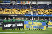 12 April 2022; Republic of Ireland players stand with a banner in support of Ukraine before the FIFA Women's World Cup 2023 qualifying match between Sweden and Republic of Ireland at Gamla Ullevi in Gothenburg, Sweden. Photo by Stephen McCarthy/Sportsfile