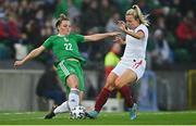 12 April 2022; Abbie Magee of Northern Ireland in action against Lauren Hemp of England during the FIFA Women's World Cup 2023 qualifier match between Northern Ireland and England at National Stadium at Windsor Park in Belfast. Photo by Ramsey Cardy/Sportsfile