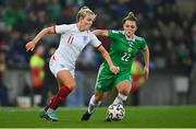 12 April 2022; Lauren Hemp of England in action against Abbie Magee of Northern Ireland during the FIFA Women's World Cup 2023 qualifier match between Northern Ireland and England at National Stadium at Windsor Park in Belfast. Photo by Ramsey Cardy/Sportsfile