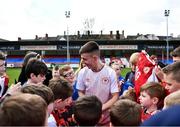 13 April 2022; Darragh Burns signs autographs for Easter Camp attendees during a meet and greet after a St Patrick's Athletic open training session at Richmond Park in Dublin. Photo by David Fitzgerald/Sportsfile