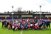 13 April 2022; St Patrick's Athletic players pose for a photo with Easter Camp attendees during a meet and greet after an open training session at Richmond Park in Dublin. Photo by David Fitzgerald/Sportsfile