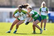 3 April 2022; Fiona Dempsey of Offaly and Meadhbh MacNamara of Limerick during the Lidl Ladies Football National League Division 4 Final match between Limerick and Offaly at St Brendan's Park in Birr, Offaly. Photo by Ben McShane/Sportsfile