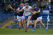 13 April 2022; Joe Booth of Waterford in action against Paddy Creedon, left, and Luke Shanahan of Tipperary during the 2022 oneills.com Munster GAA Hurling Under 20 Championship Group 2 Round 2 match between Tipperary and Waterford at FBD Semple Stadium in Thurles, Tipperary. Photo by Seb Daly/Sportsfile