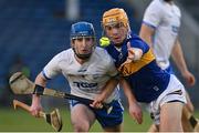 13 April 2022; Peter McGarry of Tipperary in action against Jack Ó Floinn of Waterford during the 2022 oneills.com Munster GAA Hurling Under 20 Championship Group 2 Round 2 match between Tipperary and Waterford at FBD Semple Stadium in Thurles, Tipperary. Photo by Seb Daly/Sportsfile