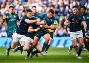 15 April 2022; Tiernan O'Halloran of Connacht is tackled by Garry Ringrose, left, and Robbie Henshaw of Leinster during the Heineken Champions Cup Round of 16 Second Leg match between Leinster and Connacht at Aviva Stadium in Dublin. Photo by David Fitzgerald/Sportsfile