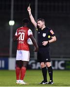15 April 2022; Referee Paul McLoughlin issues a yellow card to James Abankwah of St Patrick's Athletic during the SSE Airtricity League Premier Division match between Shamrock Rovers and St Patrick's Athletic at Tallaght Stadium in Dublin. Photo by Ben McShane/Sportsfile