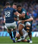 15 April 2022; Bundee Aki of Connacht is tackled by Ross Byrne and Josh van der Flier of Leinster during the Heineken Champions Cup Round of 16 Second Leg match between Leinster and Connacht at Aviva Stadium in Dublin. Photo by Brendan Moran/Sportsfile