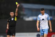 15 April 2022; Adam Thomas of Shelbourne is shown a yellow card by referee Rob Hennessy during the SSE Airtricity League Premier Division match between Derry City and Shelbourne at The Ryan McBride Brandywell Stadium in Derry. Photo by Stephen McCarthy/Sportsfile