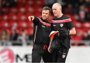 15 April 2022; Derry City kitman Georgie Hegarty, right, and Derry City strength & conditioning coach Kevin McCreadie during the SSE Airtricity League Premier Division match between Derry City and Shelbourne at The Ryan McBride Brandywell Stadium in Derry. Photo by Stephen McCarthy/Sportsfile