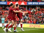 16 April 2022; Joey Carbery of Munster celebrates with teammates Mike Haley and Conor Murray after scoring his side's first try during the Heineken Champions Cup Round of 16 Second Leg match between Munster and Exeter Chiefs at Thomond Park in Limerick. Photo by Harry Murphy/Sportsfile