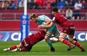 16 April 2022; Jannes Kirsten of Exeter Chiefs is tackled by Josh Wycherley and Jean Kleyn of Munster during the Heineken Champions Cup Round of 16 Second Leg match between Munster and Exeter Chiefs at Thomond Park in Limerick. Photo by Brendan Moran/Sportsfile