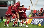 16 April 2022; Munster players, including Conor Murray, right, celebrate their side's first try during the Heineken Champions Cup Round of 16 Second Leg match between Munster and Exeter Chiefs at Thomond Park in Limerick. Photo by Harry Murphy/Sportsfile