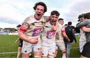 16 April 2022; Max Dunne, left, and Stephen Woods of Trinity celebrate after their victory in the Frazer McMullen all Ireland club U20 Rugby final match between UCD and Trinity at Lakelands Park, Terenure in Dublin. Photo by Ben McShane/Sportsfile