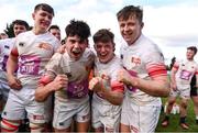 16 April 2022; Trinity players, from left, Stephen Woods, Oisin McCloskey,  Cormac King and Will Twomey celebrates after their victory in the Frazer McMullen all Ireland club U20 Rugby final match between UCD and Trinity at Lakelands Park, Terenure in Dublin. Photo by Ben McShane/Sportsfile