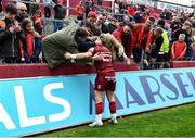 16 April 2022; Craig Casey of Munster celebrates with supporters after the Heineken Champions Cup Round of 16 Second Leg match between Munster and Exeter Chiefs at Thomond Park in Limerick. Photo by Harry Murphy/Sportsfile