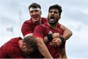 16 April 2022; Damian de Allende of Munster celebrates with teammates Stephen Archer and Thomas Ahern after scoring their side's second try during the Heineken Champions Cup Round of 16 Second Leg match between Munster and Exeter Chiefs at Thomond Park in Limerick. Photo by Brendan Moran/Sportsfile