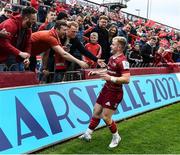 16 April 2022; Craig Casey of Munster celebrates with supporters after the Heineken Champions Cup Round of 16 Second Leg match between Munster and Exeter Chiefs at Thomond Park in Limerick. Photo by Harry Murphy/Sportsfile
