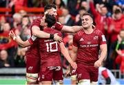 16 April 2022; Munster players, from left, Thomas Ahern, Joey Carbery and Alex Kendellen embrace after their side's victory in the Heineken Champions Cup Round of 16 Second Leg match between Munster and Exeter Chiefs at Thomond Park in Limerick. Photo by Harry Murphy/Sportsfile