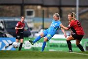 16 April 2022; Avril Brierley of DLR Waves has a shot on goal despite the attenion of Ciara Maher of Bohemians during the SSE Airtricity Women's National League match between Bohemians and DLR Waves at Dalymount Park in Dublin. Photo by Ben McShane/Sportsfile