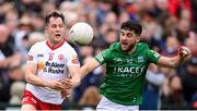 16 April 2022; Kieran McGeary of Tyrone in action against Ryan Lyons of Fermanagh during the Ulster GAA Football Senior Championship preliminary round match between Fermanagh and Tyrone at Brewster Park in Enniskillen, Fermanagh. Photo by Stephen McCarthy/Sportsfile