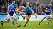 16 April 2022; Chris Crummey of Dublin is tackled by Ross King of Laois during the Leinster GAA Hurling Senior Championship Round 1 match between Dublin and Laois at Parnell Park in Dublin. Photo by Eóin Noonan/Sportsfile