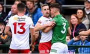 16 April 2022; Niall Sludden of Tyrone and Johnny Cassidy of Fermanagh tussle during the Ulster GAA Football Senior Championship preliminary round match between Fermanagh and Tyrone at Brewster Park in Enniskillen, Fermanagh. Photo by Stephen McCarthy/Sportsfile