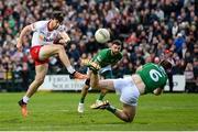 16 April 2022; Conor McKenna of Tyrone has a shot on goal blocked by Richard O'Callaghan of Fermanagh during the Ulster GAA Football Senior Championship preliminary round match between Fermanagh and Tyrone at Brewster Park in Enniskillen, Fermanagh. Photo by Stephen McCarthy/Sportsfile