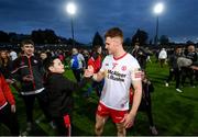 16 April 2022; Conor Meyler of Tyrone is congratulated by supporter Tadhg Turbot, age 12, from Omagh, Tyrone during the Ulster GAA Football Senior Championship preliminary round match between Fermanagh and Tyrone at Brewster Park in Enniskillen, Fermanagh. Photo by Stephen McCarthy/Sportsfile