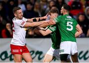 16 April 2022; Niall Sludden of Tyrone tussles with Josh Largo Ellis and James McMahon, right, of Fermanagh during the Ulster GAA Football Senior Championship preliminary round match between Fermanagh and Tyrone at Brewster Park in Enniskillen, Fermanagh. Photo by Stephen McCarthy/Sportsfile