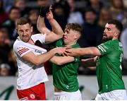 16 April 2022; Niall Sludden of Tyrone tussles with Josh Largo Ellis and James McMahon, right, of Fermanagh during the Ulster GAA Football Senior Championship preliminary round match between Fermanagh and Tyrone at Brewster Park in Enniskillen, Fermanagh. Photo by Stephen McCarthy/Sportsfile