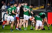 16 April 2022; Conor McKenna of Tyrone and Brandon Horan of Fermanagh, 9, tussle during the Ulster GAA Football Senior Championship preliminary round match between Fermanagh and Tyrone at Brewster Park in Enniskillen, Fermanagh. Photo by Stephen McCarthy/Sportsfile