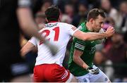 16 April 2022; Declan McClusker of Fermanagh is tackled by Conor McKenna of Tyrone, resulting in a yellow card for the Tyrone player, during the Ulster GAA Football Senior Championship preliminary round match between Fermanagh and Tyrone at Brewster Park in Enniskillen, Fermanagh. Photo by Stephen McCarthy/Sportsfile