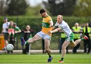17 April 2022; Mark Plunkett of Leitrim gets a shot away under pressure from Stephen Dornan of London during the Connacht GAA Football Senior Championship Quarter-Final match between London and Leitrim at McGovern Park in Ruislip, London, England. Photo by Sam Barnes/Sportsfile