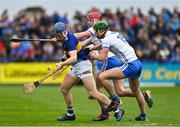 17 April 2022; James Quigley of Tipperary is tackled by Calum Lyons and Michael Kiely of Waterford during the Munster GAA Hurling Senior Championship Round 1 match between Waterford and Tipperary at Walsh Park in Waterford. Photo by Brendan Moran/Sportsfile