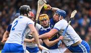 17 April 2022; Conor Stakelum of Tipperary is tackled by Conor Gleeson, Tadhg de Burca and Conor Prunty of Waterford during the Munster GAA Hurling Senior Championship Round 1 match between Waterford and Tipperary at Walsh Park in Waterford. Photo by Brendan Moran/Sportsfile