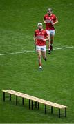 17 April 2022; Cork players Tim O'Mahony, left, and Mark Coleman make their way to the bench for the team photograph before the Munster GAA Hurling Senior Championship Round 1 match between Cork and Limerick at Páirc Uí Chaoimh in Cork. Photo by Stephen McCarthy/Sportsfile