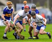 17 April 2022; Darragh Lyons of Waterford, supported by teammate Tadhg De Búrca, left, in action against Tipperary players Jake Morris, left, and Alan Flynn during the Munster GAA Hurling Senior Championship Round 1 match between Waterford and Tipperary at Walsh Park in Waterford. Photo by Piaras Ó Mídheach/Sportsfile