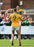 17 April 2022; Emlyn Mulligan of Leitrim, right, with team-mate Donal Wrynn, 9, celebrate after their side's victory in the Connacht GAA Football Senior Championship Quarter-Final match between London and Leitrim at McGovern Park in Ruislip, London, England. Photo by Sam Barnes/Sportsfile