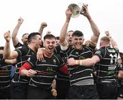 17 April 2022; Kilkenny captain Jake McDonald lifts the trophy with teammates after the Bank of Ireland Leinster Rugby Provincial Towns Cup Final match between Ashbourne RFC and Kilkenny RFC at Cill Dara RFC in Kildare. Photo by Harry Murphy/Sportsfile