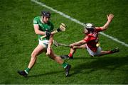 17 April 2022; Darragh O'Donovan of Limerick in action against Ger Millerick of Cork during the Munster GAA Hurling Senior Championship Round 1 match between Cork and Limerick at Páirc Uí Chaoimh in Cork. Photo by Stephen McCarthy/Sportsfile