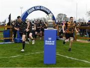 17 April 2022; Ashbourne and Kilkenny players run out past the trophy before the Bank of Ireland Leinster Rugby Provincial Towns Cup Final match between Ashbourne RFC and Kilkenny RFC at Cill Dara RFC in Kildare. Photo by Harry Murphy/Sportsfile
