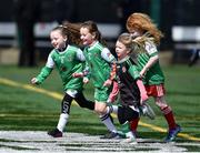 17 April 2022; Rockland GAA Club U7 players, left to right, Layla Crosby, Méabh Kelly, Nora Ryan, and Omra Timothy, run onto the pitch at half time of the Connacht GAA Football Senior Championship Quarter-Final match between New York and Sligo at Gaelic Park in New York, USA. Photo by Daire Brennan/Sportsfile