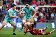 16 April 2022; Santiago Grondona of Exeter Chiefs is tackled by Joey Carbery of Munster during the Heineken Champions Cup Round of 16 Second Leg match between Munster and Exeter Chiefs at Thomond Park in Limerick. Photo by Harry Murphy/Sportsfile