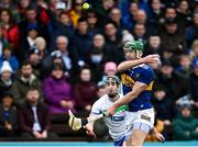 17 April 2022; Noel McGrath of Tipperary handpasses the ball as Conor Gleeson of Waterford closes in during the Munster GAA Hurling Senior Championship Round 1 match between Waterford and Tipperary at Walsh Park in Waterford. Photo by Piaras Ó Mídheach/Sportsfile