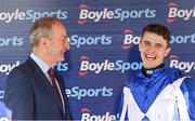 18 April 2022; Jockey Paddy O'Hanlon with An Taoiseach Micheál Martin TD after winning the BoyleSports Irish Grand National Steeplechase on Lord Lariat during day three of the Fairyhouse Easter Festival at Fairyhouse Racecourse in Ratoath, Meath. Photo by Seb Daly/Sportsfile
