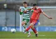 18 April 2022; Joe Adams of Dundalk in action against Dylan Watts of Shamrock Rovers during the SSE Airtricity League Premier Division match between Shamrock Rovers and Dundalk at Tallaght Stadium in Dublin. Photo by Eóin Noonan/Sportsfile