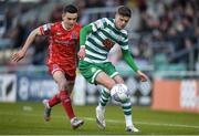 18 April 2022; Sean Gannon of Shamrock Rovers in action against Darragh Leahy of Dundalk during the SSE Airtricity League Premier Division match between Shamrock Rovers and Dundalk at Tallaght Stadium in Dublin. Photo by Eóin Noonan/Sportsfile